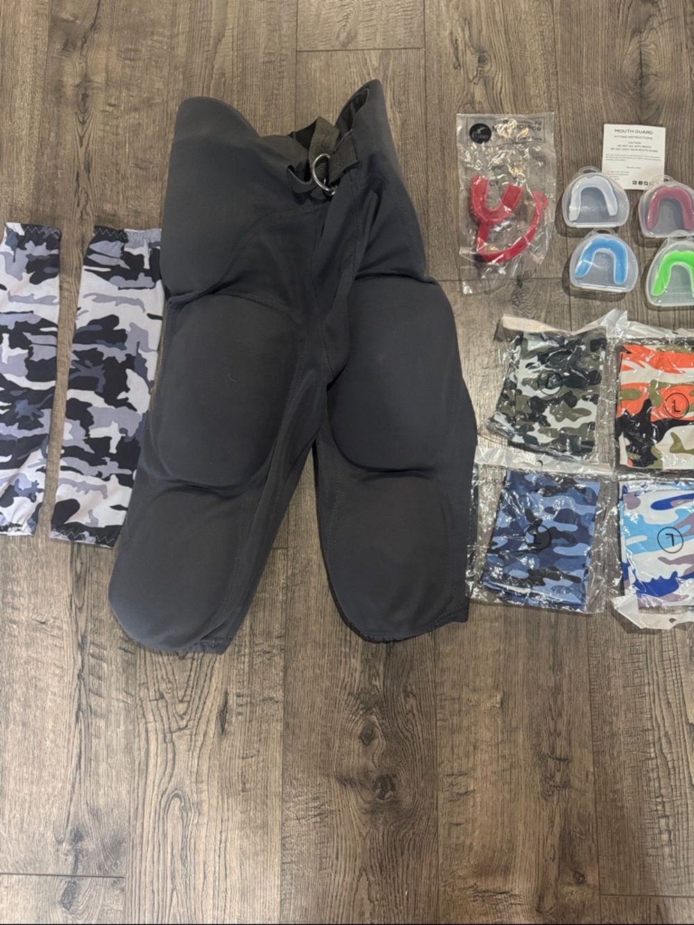 Youth Football Gear; including Russell Athletic Gray Youth Padded Football Pants